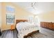 Spacious main bedroom with vaulted ceiling, fan, and large windows letting in lots of light at 10448 Niagara Falls Ln, Las Vegas, NV 89144