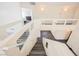 Staircase with wood-look flooring and white banister at 10448 Niagara Falls Ln, Las Vegas, NV 89144