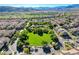 Aerial shot showcases the neighborhood park, pool, and surrounding homes at 11428 Belmont Lake Dr # 104, Las Vegas, NV 89135