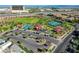 Aerial view of community park with playground, tennis courts, and parking at 11428 Belmont Lake Dr # 104, Las Vegas, NV 89135