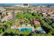 Aerial view of community park and pool with lush landscaping and mature trees at 11428 Belmont Lake Dr # 104, Las Vegas, NV 89135