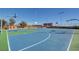 Community basketball court with well-maintained surface, hoops, and surrounding greenery at 11428 Belmont Lake Dr # 104, Las Vegas, NV 89135