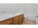 Well-lit bathroom with a single sink vanity, tile floors, and shower-tub combo at 11428 Belmont Lake Dr # 104, Las Vegas, NV 89135
