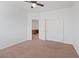 Neutral bedroom with a ceiling fan, closet, carpeted floor, and adjoined to desk area at 11428 Belmont Lake Dr # 104, Las Vegas, NV 89135