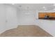 Open dining area with tile flooring, white walls, and modern lighting at 11428 Belmont Lake Dr # 104, Las Vegas, NV 89135