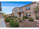 Charming two-story home with blue shutters and well-maintained landscaping at 11428 Belmont Lake Dr # 104, Las Vegas, NV 89135