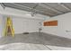 Spacious garage with a water heater, utility sink, and ample room for storage at 11428 Belmont Lake Dr # 104, Las Vegas, NV 89135
