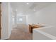 Upstairs hallway features neutral walls and carpet, wooden desk and lots of natural light at 11428 Belmont Lake Dr # 104, Las Vegas, NV 89135