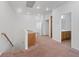 Open hallway with recessed lighting that leads to a bathroom, bedrooms, and laundry room at 11428 Belmont Lake Dr # 104, Las Vegas, NV 89135