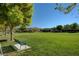 Expansive green space with a park bench and a backdrop of well-maintained homes at 11428 Belmont Lake Dr # 104, Las Vegas, NV 89135