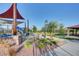 Playground with slides, climbing structures, and shaded seating areas for families to enjoy at 11428 Belmont Lake Dr # 104, Las Vegas, NV 89135