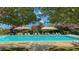 Community pool with shade umbrellas and ample lounge seating at 11428 Belmont Lake Dr # 104, Las Vegas, NV 89135