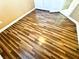 Close up on the bedrooms wood look flooring, with glimpse of the closet doors in background at 1269 Honey Lake St, Las Vegas, NV 89110