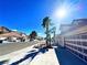 Street view of neighborhood showing tree lined street with mature palm trees and well maintained homes in the distance at 1269 Honey Lake St, Las Vegas, NV 89110