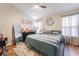 Well-lit bedroom featuring neutral colors, modern furniture, and a ceiling fan for added comfort at 128 Painted Valley St, Henderson, NV 89074