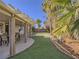 Inviting backyard patio with an outdoor dining area, perfect for entertaining guests at 1402 Bareback Ct, Henderson, NV 89014