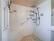 Accessible bathroom with shower seat, grab bars, and sleek shower head at 1402 Bareback Ct, Henderson, NV 89014