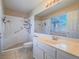 The full bathroom features sleek vanity and accessible walk-in shower at 1402 Bareback Ct, Henderson, NV 89014
