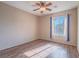 Bright bedroom with a view featuring wood flooring and neutral paint at 1402 Bareback Ct, Henderson, NV 89014