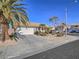 Charming single-story home with well-manicured desert landscaping and a two-car garage at 1402 Bareback Ct, Henderson, NV 89014