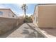 Long narrow, low-maintenance backyard featuring block wall, pavers, and crushed gravel at 1708 Matador Way, Las Vegas, NV 89128