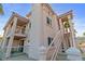 Condominium building with private balcony and exterior staircase to the second level at 1972 Las Palmas Ln # 250, Laughlin, NV 89029