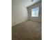 Neutral bedroom featuring plush carpeting, a window with blinds, and a closet at 2341 Celestial Moon St, Henderson, NV 89044