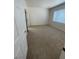 Bright, carpeted bedroom with a window and neutral walls at 2341 Celestial Moon St, Henderson, NV 89044