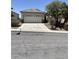 Charming single-story home featuring a well-maintained front yard with mature palm trees at 2341 Celestial Moon St, Henderson, NV 89044