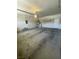 Spacious garage area with concrete floor, overhead lighting, and utility connections at 2341 Celestial Moon St, Henderson, NV 89044