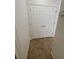 Hallway closet with double doors and tile flooring at 2341 Celestial Moon St, Henderson, NV 89044