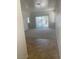 Living room view featuring carpeted flooring and a sliding glass door at 2341 Celestial Moon St, Henderson, NV 89044