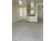 View of kitchen from the living room, featuring carpet and neutral colors at 2341 Celestial Moon St, Henderson, NV 89044