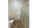 Bathroom shower with a sliding glass door and grab bars at 2341 Celestial Moon St, Henderson, NV 89044