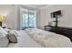 Comfortable bedroom with balcony access, dresser, and TV at 260 E Flamingo Rd # 113, Las Vegas, NV 89169