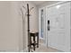 Foyer with hall tree, tile flooring, and decorative glass accent window by entry door at 260 E Flamingo Rd # 113, Las Vegas, NV 89169