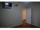 This bedroom has neutral paint, and wood-look floors and has an open door to the hall at 2601 Centaurus St, Henderson, NV 89044