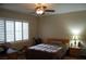 This bedroom has wood-look floors, a ceiling fan and plantation shutters at 2601 Centaurus St, Henderson, NV 89044