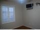 A bedroom with a window, closet, and hardwood floors at 2601 Centaurus St, Henderson, NV 89044