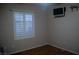 Bright bedroom with plantation shutters on the window and a mounted TV at 2601 Centaurus St, Henderson, NV 89044