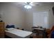 Cozy bedroom has neutral tones and is illuminated by a window with shutters at 2601 Centaurus St, Henderson, NV 89044