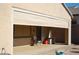 Covered patio area with outdoor seating, privacy shade, and desert landscaping at 2601 Centaurus St, Henderson, NV 89044