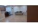 Spacious living room with tiled floors, natural light, and open access to the kitchen and dining areas at 2601 Centaurus St, Henderson, NV 89044