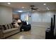 The living room has neutral tile floors, a ceiling fan and plantation shutters at 2601 Centaurus St, Henderson, NV 89044