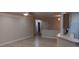 Inviting living room with neutral walls, tiled floors, and open floor plan to the front entry of the house at 2601 Centaurus St, Henderson, NV 89044