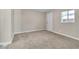 Bright bedroom boasts carpeted floors, natural light, and easy access to the exterior at 2716 Salt Lake St, North Las Vegas, NV 89030