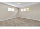 Inviting bedroom with natural light from two windows and comfortable carpeting at 2716 Salt Lake St, North Las Vegas, NV 89030