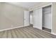 Well-lit bedroom with hardwood floors, a spacious closet, and access to other areas at 2716 Salt Lake St, North Las Vegas, NV 89030