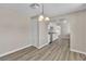 Cozy dining room with modern lighting, updated flooring, and convenient access to the kitchen at 2716 Salt Lake St, North Las Vegas, NV 89030