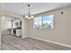 Dining area featuring modern lighting, updated flooring, and access to the updated kitchen at 2716 Salt Lake St, North Las Vegas, NV 89030